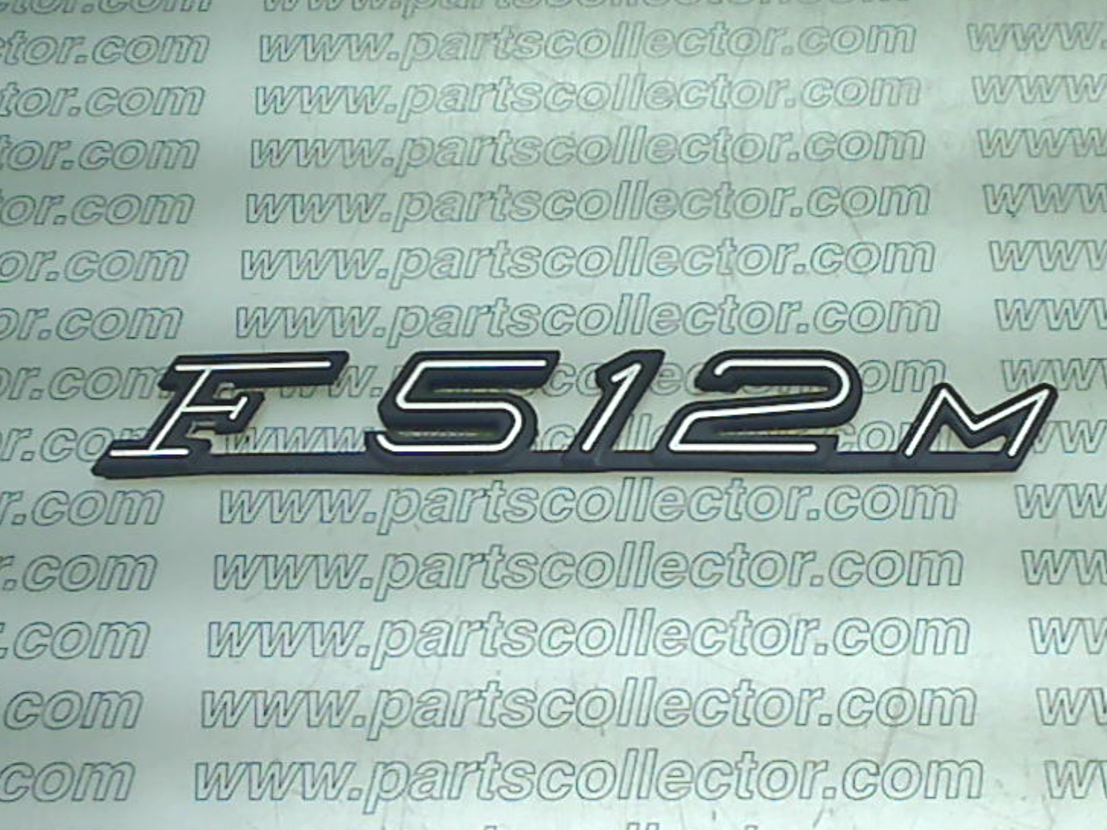 F512 M BADGE